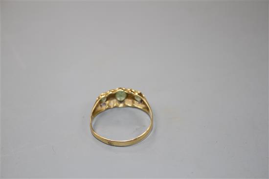 An early 20th century 18ct gold, green tourmaline and diamond chip set half hoop ring,